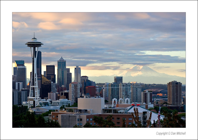 SeattleSkylineMorning2006|07|30: Morning, Seattle Center and Mt. Rainier. Seattle, Washington. July 30, 2006. &copy; Copyright G Dan Mitchell.    keywords: seattle center downtown space needle skyline mount mt. rainier dawn sunrise morning pink clouds washington color photograph