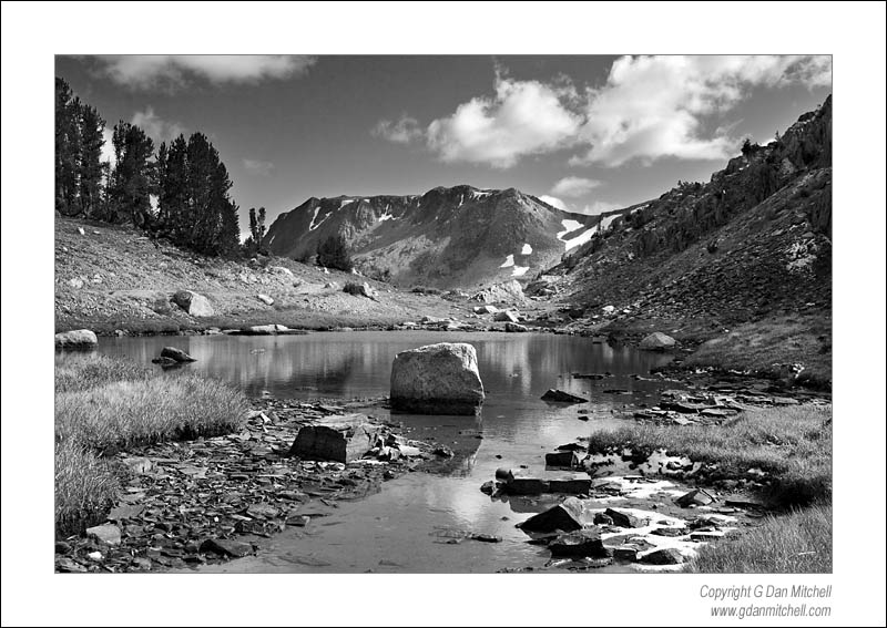 TarnRockPeakBW2006|10|07: Tarn, Rock, Peak. (Monochrome) Twenty Lakes Basin, Sierra Nevada. October 7, 2006. &copy; "copyright g dan mitchell". ("sales")    keywords: tarn lake rock reflections peak clouds autumn light snow twenty lakes basin sierra nevada mountains california black and white photograph