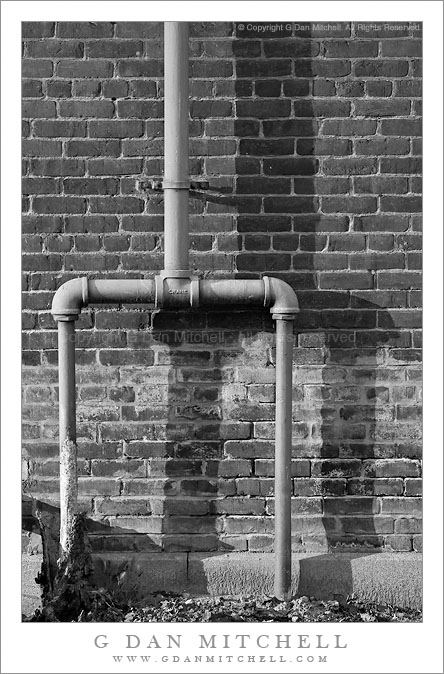 Pipes, Shadow, and Brick Wall Pipes, Shadow, and Brick Wall