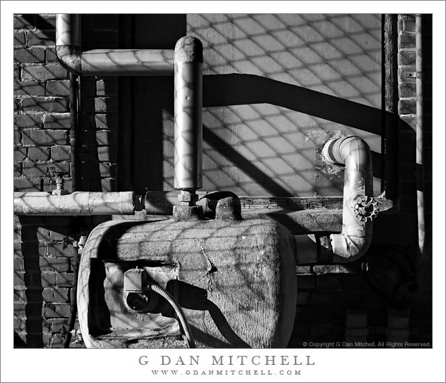 Pipes, Tank, and Cyclone Fence Shadows Pipes, Tank, and Cyclone Fence Shadows