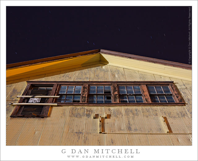 Yellow Building with Weathered Windows, Night Sky Yellow Building with Weathered Windows, Night Sky