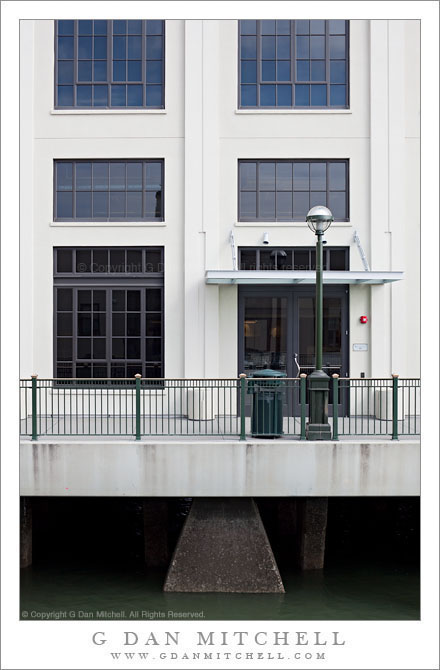 White Waterfront Building, Sidewalk, and Lamp