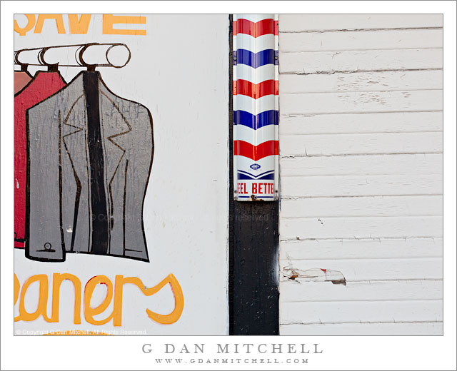"Feel Better" "Feel Better" - A barber "pole" with the words "Feel Better" and a hand painted laundry sign on the exterior wall of a dilapidated building, San Jose, California.