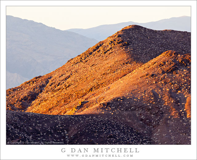 Death Valley Buttes, Morning Death Valley Buttes, Morning - Early morning light on the summit of the Death Valley Buttes, with the Panamint Range in the distance, Death Valley National Park, California.