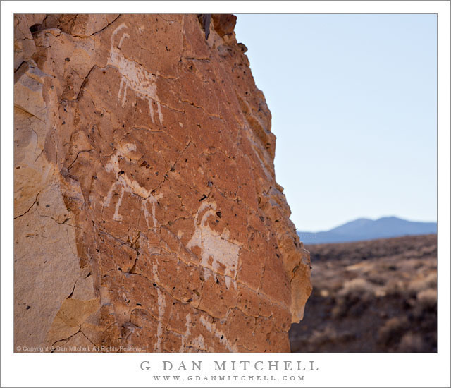 Petroglyphs Petroglyphs - Petroglyphs on a rock face overlooking desert terrain