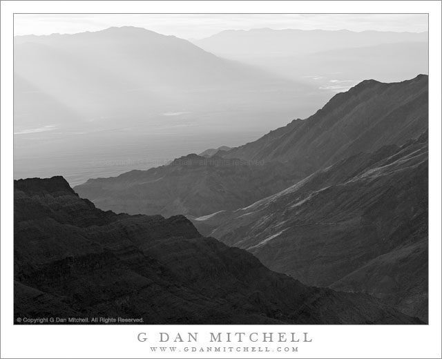 Death Valley and Trail Canyon, Morning Death Valley and Trail Canyon, Morning -Dawn light comes over the Black Mountains to illuminate Death Valley and Trail Canyon at the base of the Panamint Range, Death Valley National Park.